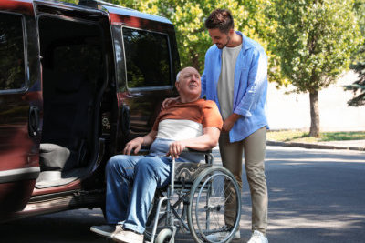 young man helping the old man