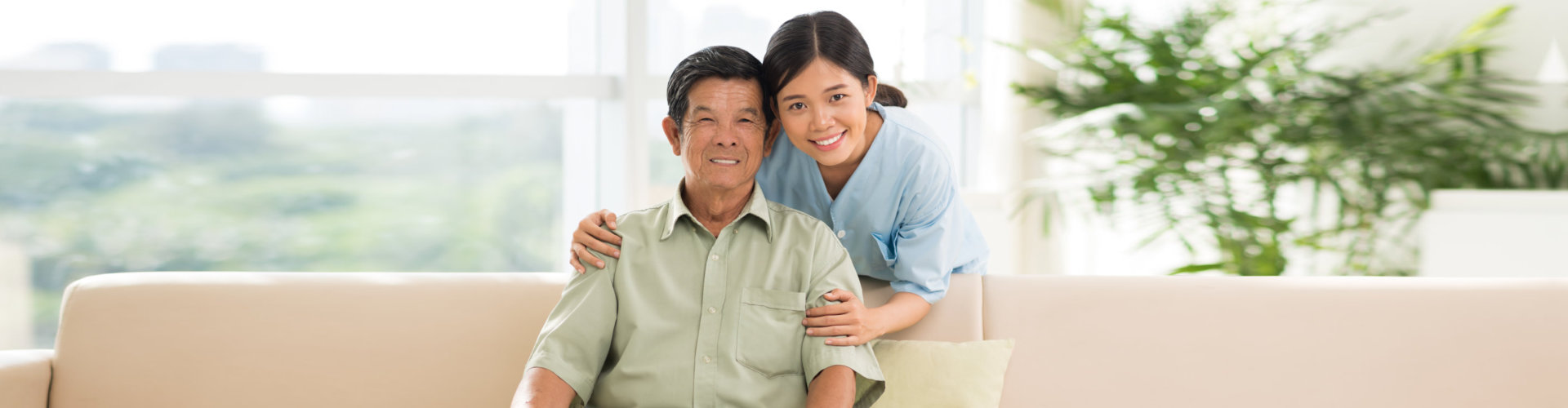 elderly man and staff smiling